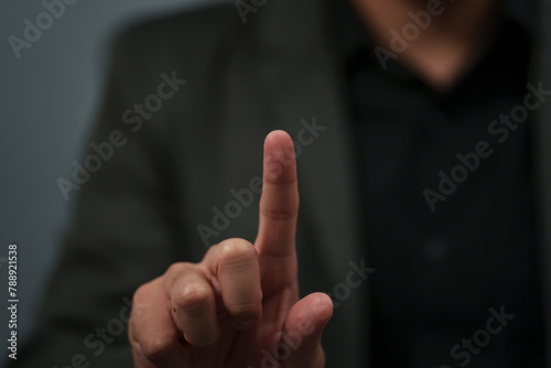 businessman in suit pointing or fingerprint scan touching