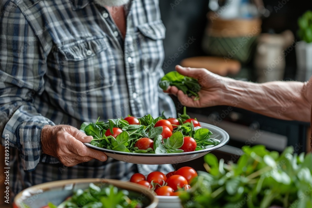 A man is holding a black bowl of salad. Healthy concept A man is holding a black bowl of salad. Healthy concept
