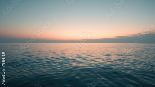Minimalist sunrise over a calm ocean with a subtle gradient sky and a hint of light on the water