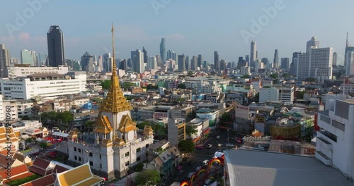 An aerial view of the Traimit Withayaram temple or Golden Buddha Temple, The most famous tourist attraction in Bangkok, Thailand. photo