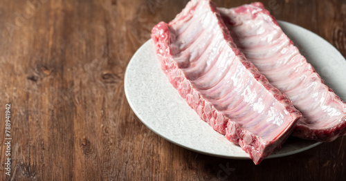 Raw back ribs on a plate