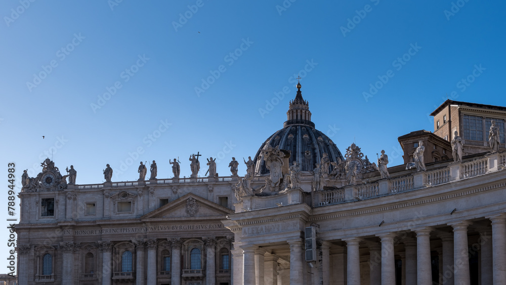 Architectural detail of Saint Peter's Basilica in Vatican City, the papal enclave in Rome, showcasing intricate design elements and structural features.