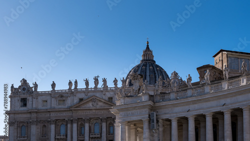 Architectural detail of Saint Peter's Basilica in Vatican City, the papal enclave in Rome, showcasing intricate design elements and structural features.