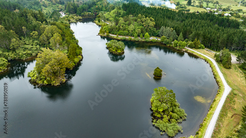 Drone perspective  of Lake Mangamahoe Taranaki  surrounded by forest