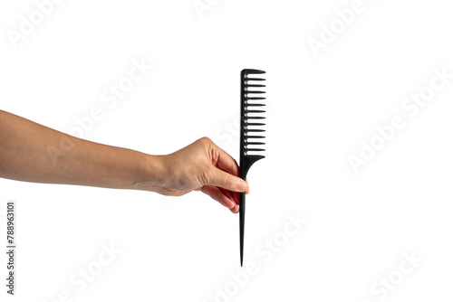 Black hair comb in hand isolated on transparent background