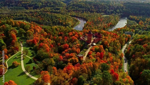 Aerial View Of Turaida Castle, Dense Forest And Gauja River In Autumn In Vidzeme, Latvia photo