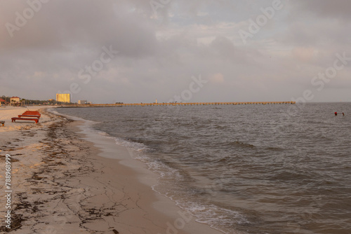 A scenic sunset view of a beach on the Gulf of Mexico in Biloxi, Mississippi, United States of America.