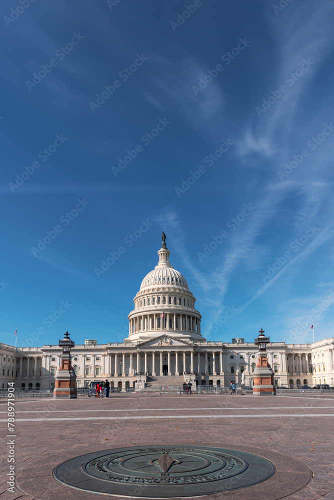 Fototapeta premium A symbol of Democracy. Capitol Building against blue sky, Washington, DC.