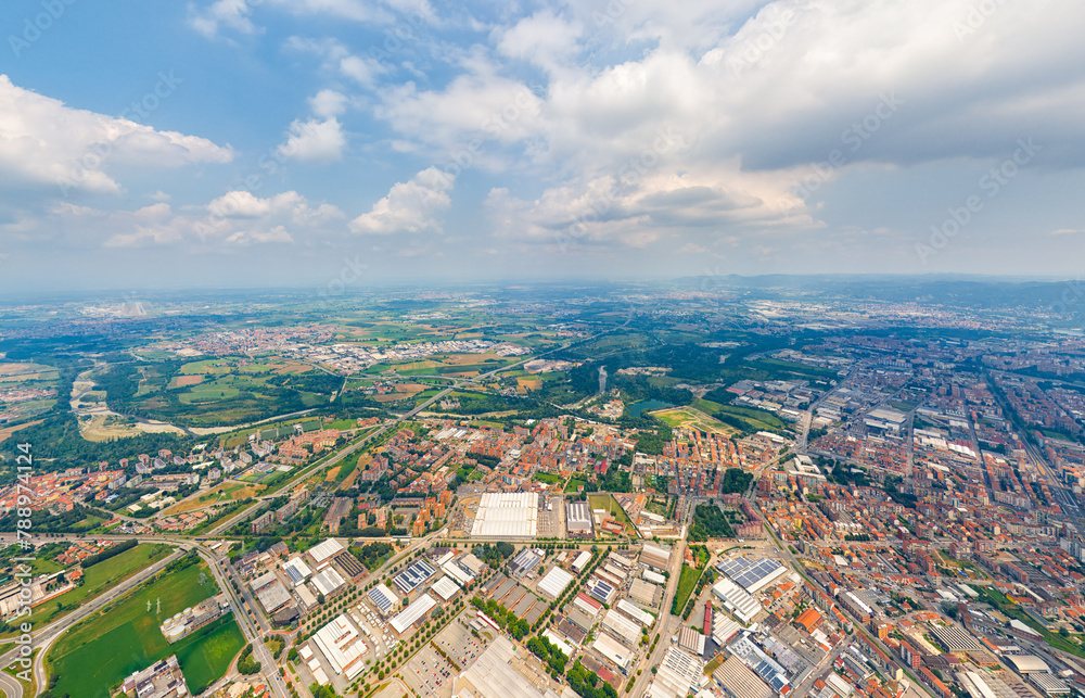 Turin, Italy. Panorama of the city in summer. Industrial and residential areas. Fields. Aerial view