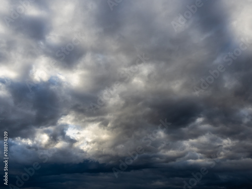 Dark blue moody sky clouds background overcast storm thunderstorm rainy weather gray