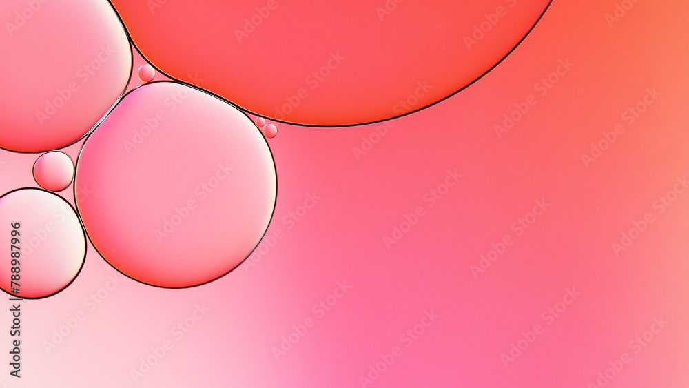 oil and water macro abstract photography on pink background