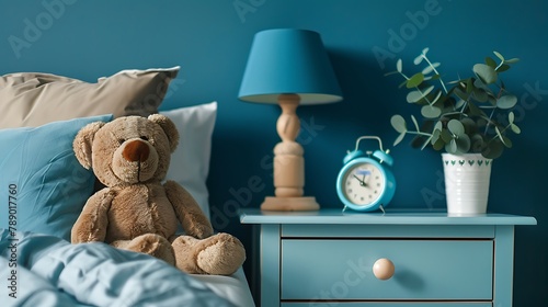 cute kids toys on the nightstand in blue nursery