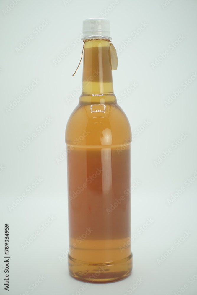 Bottle of honey in a glass jar