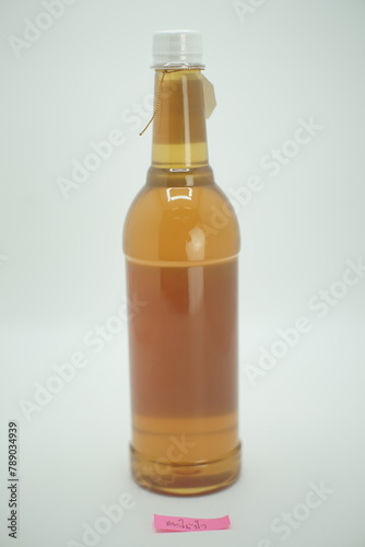 Bottle of honey in a glass jar photo