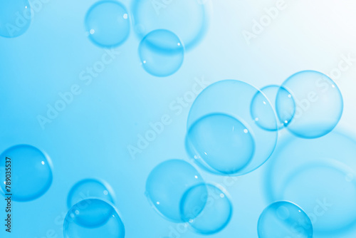 Beautiful Blue Soap Bubbles Floating in The Air. Celebration Festive Backdrop. Freshness Soap Suds Bubbles Water. Abstract Blue Textured Background.