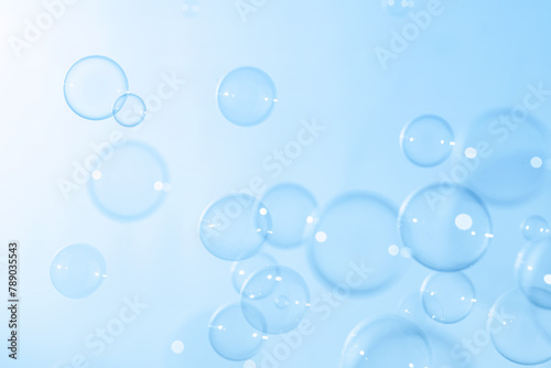 Beautiful Transparent Soap Bubbles Floating in The Air. Celebration Festive Backdrop. Freshness Soap Suds Bubbles Water. Abstract Blue Textured Background.