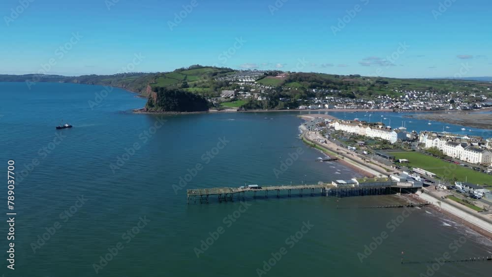 Teignmouth, South Devon, England: DRONE VIEWS: The drone circles the Grand Pier with the River Teign in the background. Teignmouth is both a port town and a popular English holiday destination (2)