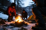 The man is building a fire. Setting Up Campfire in the Mountains. Warmth, Camaraderie, and Alpine Adventure. Soft Glow of the Campfire Illuminates the Atmosphere.