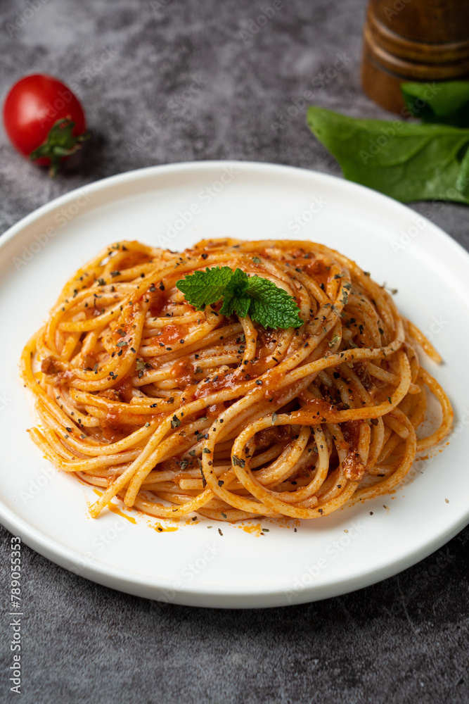 Traditional pasta spaghetti in plate on table. Traditional pasta spaghetti in plate on table.