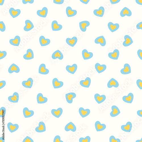 Vector illustration. Seamless pattern of small yellow-blue hearts on a light milky white background. Textile printing, fabric design, packaging, wrapping paper, children's wallpaper