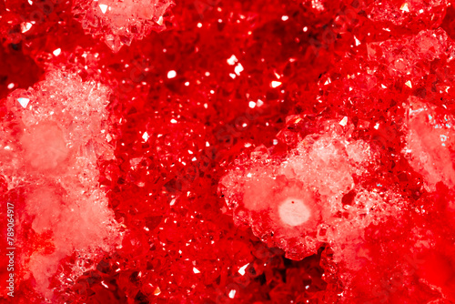 Amethyst red crystals. Gems. Mineral crystals in the natural environment. Texture of precious and semiprecious stones. Seamless background with copy space colored shiny surface of precious stones.