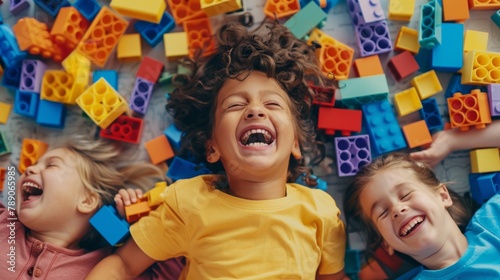 A group of children laughing and playing with colorful blocks, fostering creativity and imagination through the joy of building and construction.
