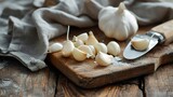 Peeled Garlic Cloves on Chopping Board Next to Knife: Culinary Preparation
