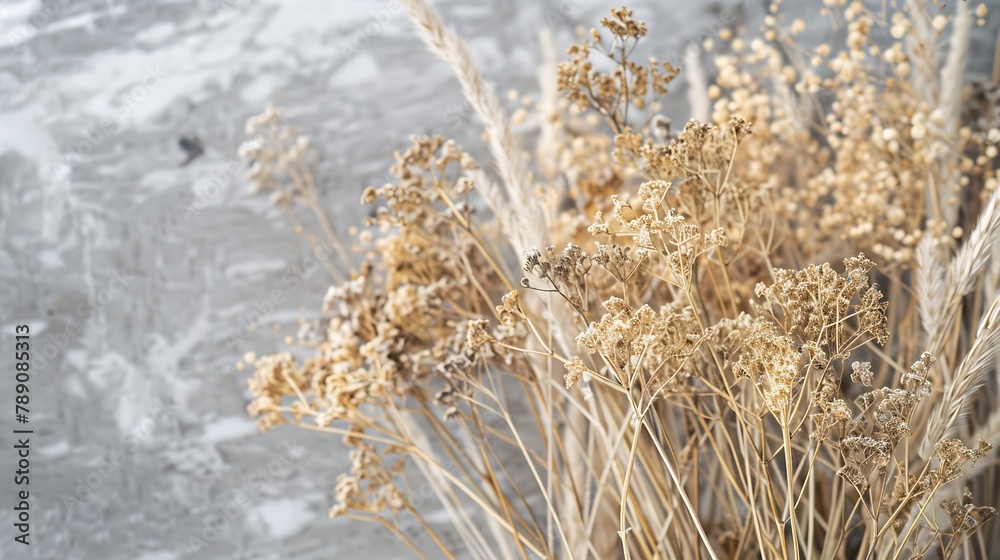 Fototapeta premium Dried flowers bouquet close up dried herbs at gray marble background preserved field reed grass Calamagrostis for home decoration object photography floristics craft natural dried plan : Generative AI