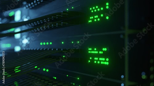 Close-up view of modern internet network switch with plugged ethernet cables. Blinking lights on internet server. Concept of big data center mining. Cloud computing and telecommunications