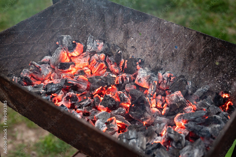 grill with hot coals, close-up