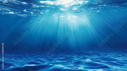 Under blue sea Bathed in Blue clear Sunlight shining into the ocean abstract natural background photo