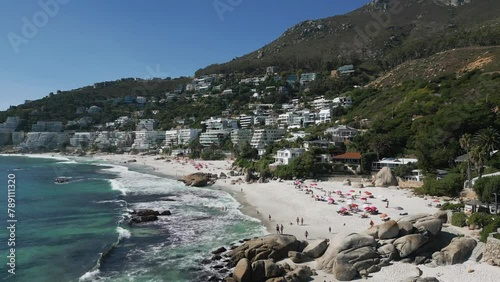 Drone shot of waves crashing onto the beach at Cape Town, South Africa.