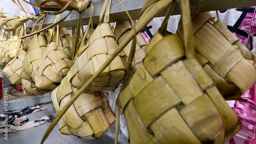 Ketupat Rice Dumpling Special Dish served at Eid Mubarak. Ketupat is Cooked Rice with Young Coconut Leaves Casing Eid al Fitr Moslem Celebration. Popular indonesian traditional Syawal food