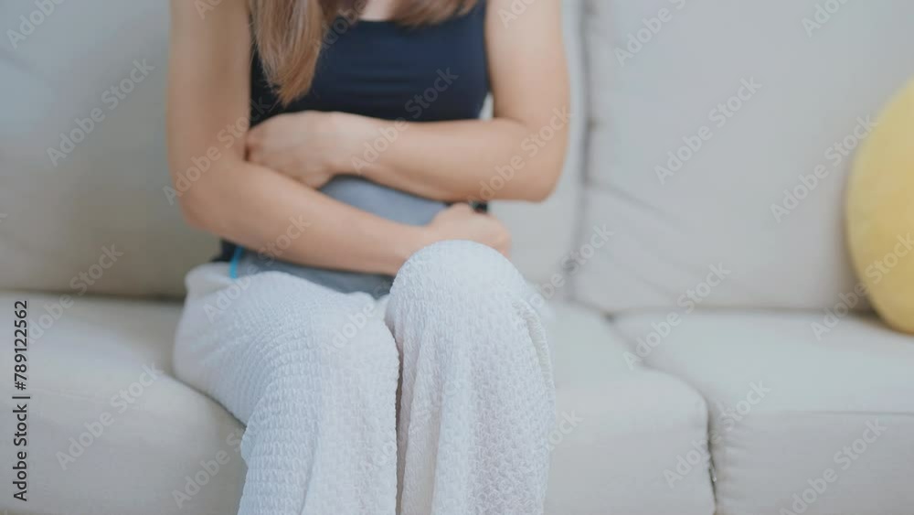 Menstruation period cycle of monthly and Stomachache concepts. woman having abdomen pain and menstrual ache with hot water bottle, illness female suffer from premenstrual ache and body Health problem Menstruation period cycle of monthly and Stomachache concepts. woman having abdomen pain and menstrual ache with hot water bottle, illness female suffer from premenstrual ache and body Health problem