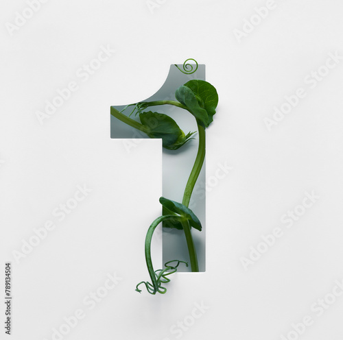The number one is made from young pea shoots on a white background.