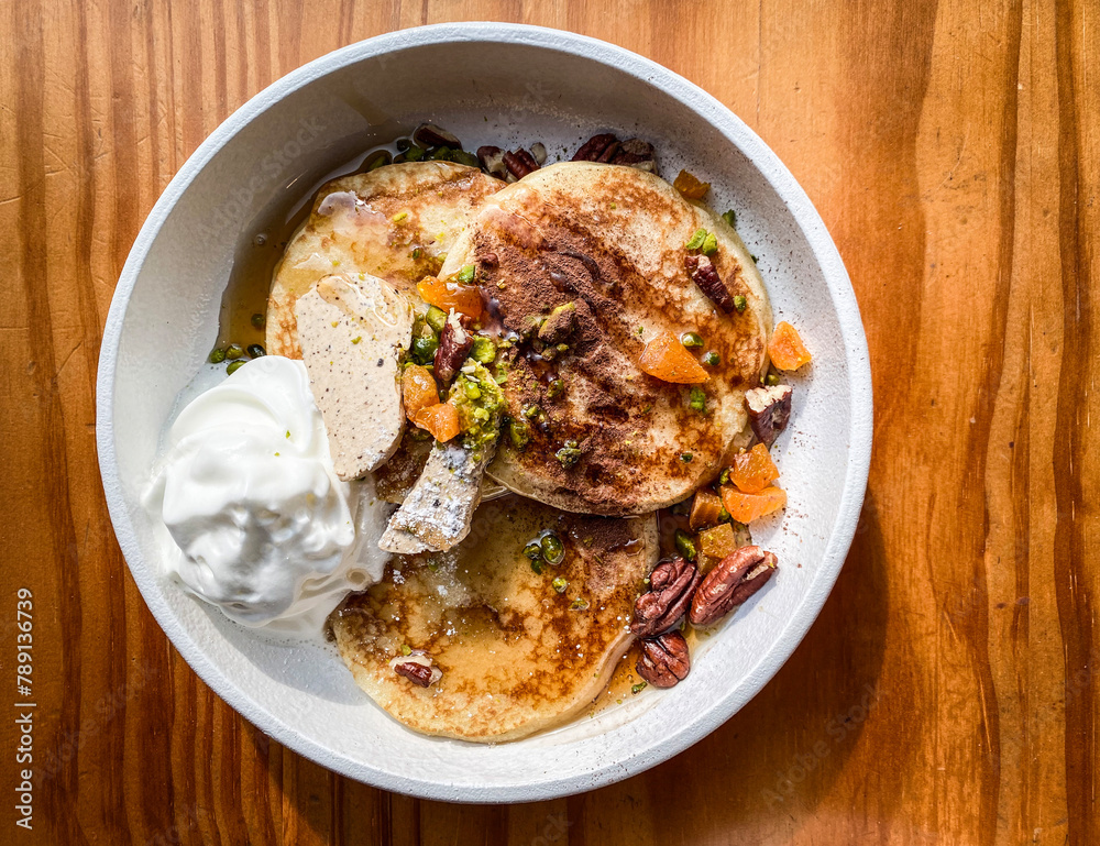 Delicious Homemade Pancakes with Syrup and Nuts