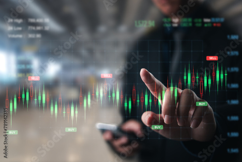 Businessperson pointing to stock market buy and sell signals on a digital screen.