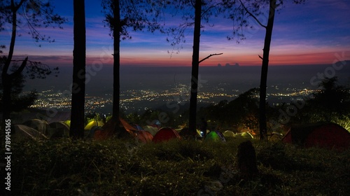 Beautiful Sunrise Through Trees of Mt Ungaran Campground, Semarang, Indonesia photo