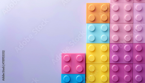 Toy blocks colorful background. pile various colorful rainbow colored stackable plastic toy bricks isolated on pastel background.. childhood education construction concept Copy space