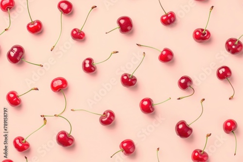 Vibrant Red Cherries Scattered on a Soft Pink Background for Fresh Summer Design