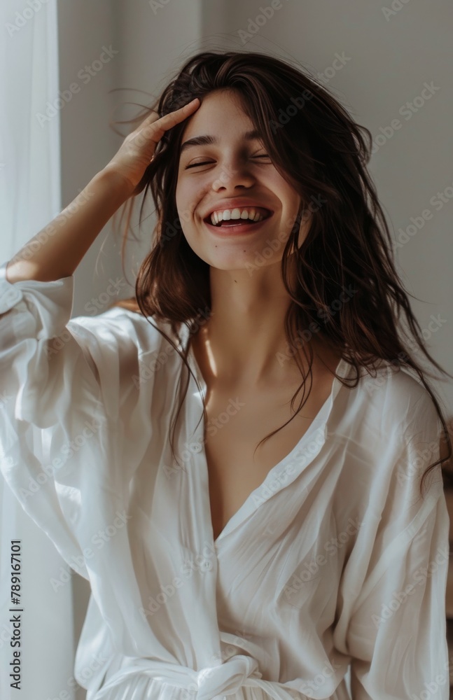 Woman Smiling and Holding Hair