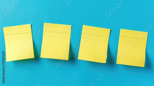 yellow sticky post it notes on blue background photo