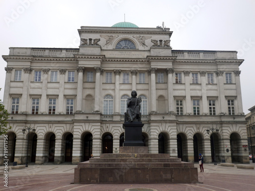 Warsaw, Poland. The Nicolaus Copernicus Monument in Warsaw is one of the Polish capital's notable landmarks. It stands before the Staszic Palace. photo