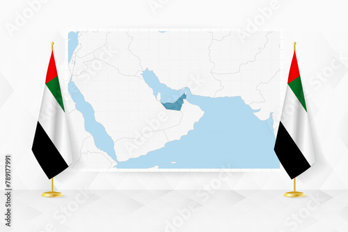 Map of United Arab Emirates and flags of United Arab Emirates on flag stand.