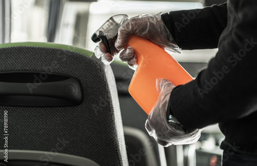 Coach Bus Owner Sanitizing and Cleaning Vehicle Seats