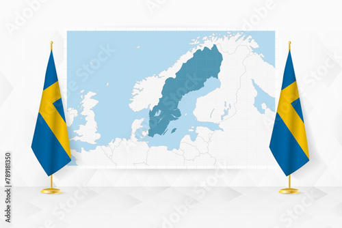 Map of Sweden and flags of Sweden on flag stand.