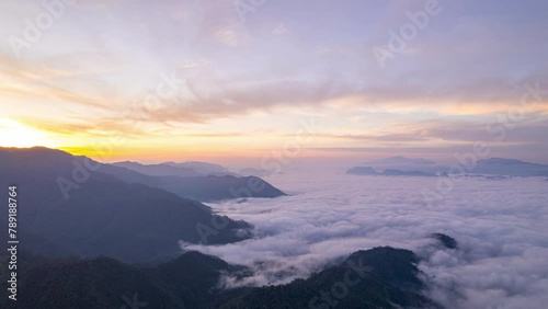 Aerial fly drone hyperlapse foggy or the clouds while sunrise sky, sea of fog mount nature.	