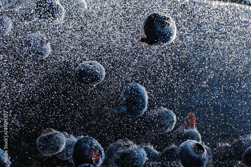 Water drops on ripe sweet blueberry. Fresh blueberries background with copy space for your text. Vegan and vegetarian concept.