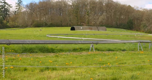 The track of a summer toboggan run for a bobsleigh-like sled runs through the meadows. photo