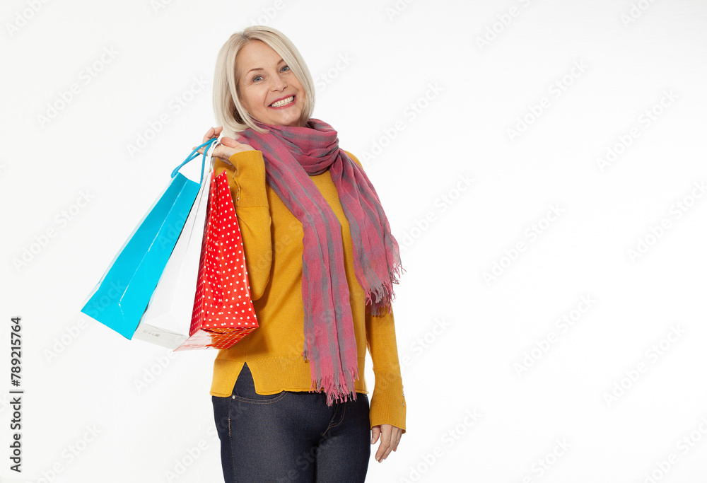 Shopper. Shopaholic shopping woman holding many shopping bags excited isolated on white. Shopper. Shopaholic shopping woman holding many shopping bags excited isolated on white.